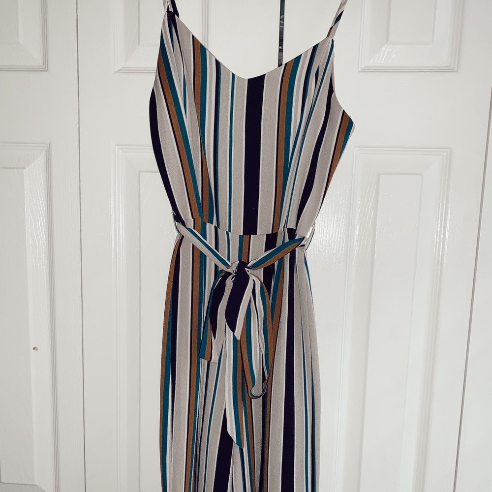 Multicolored striped jump suit with tie waist.